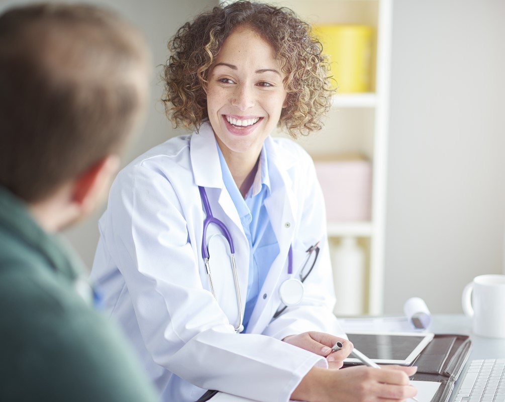 Doctor smiling at her patient.